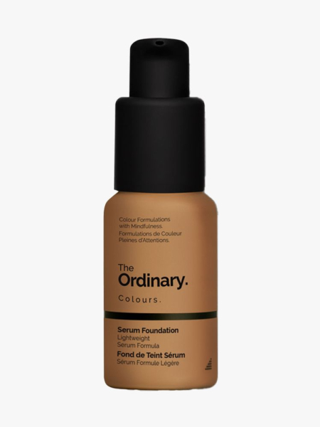 Bottle of The Ordinary Serum Foundation with black cap on light gray background